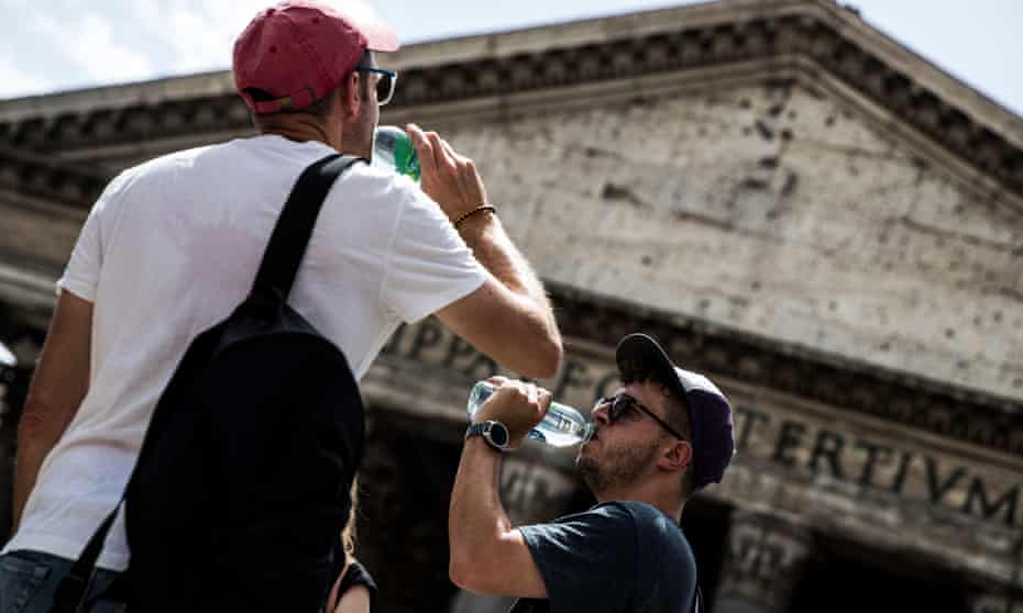 Tourists in Rome trying to cool off as temperatures reached 35C last week.   