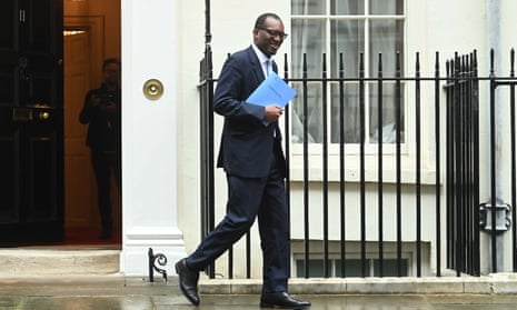Kwasi Kwarteng leaves 11 Downing Street before announcing his plans on Friday.