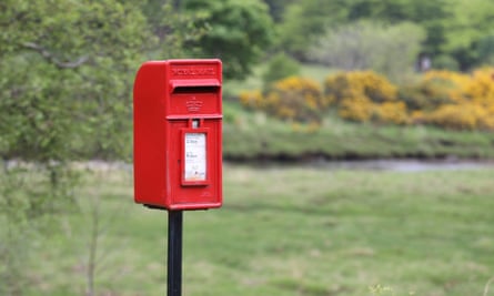 A postbox on Mull surrounded by fields.