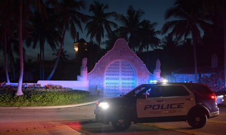 Authorities stand outside Mar-a-Lago, the residence of former president Donald Trump, amid reports of the FBI executing a search warrant as a part of a document investigation, in Palm Beach, Florida Monday.