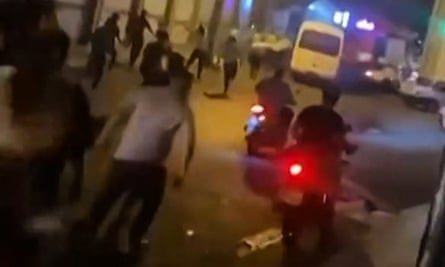 A video reportedly shows Iranian protesters clashing with security forces in the northern city of Rasht, Iran