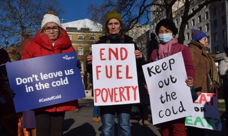 Protesters in London hold signs calling for an end to fuel poverty and help with heating bills.