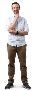 Mike, white and bearded, stands with hand on chin wearing pale shirt, dark trousers and shoes