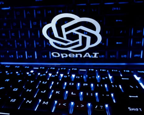 A glowing OpenAI logo is displayed above an illuminated computer keyboard in darkness