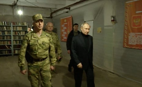In this picture, Putin visits the national guard headquarters in the occupied Luhansk region.