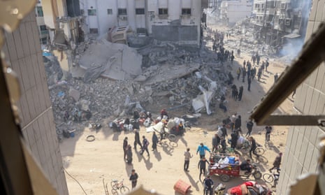 Palestinians inspect the damage at and near Al-Shifa Hospital after the Israeli army withdrew from it following a two-week military operation, in Gaza City, 01 April 2024.
