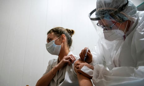 A medic of the regional hospital receives Russia's Sputnik-V vaccine