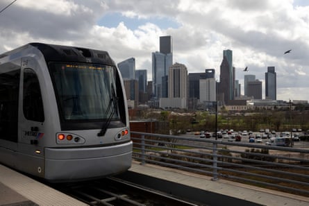 A train with the city in the background