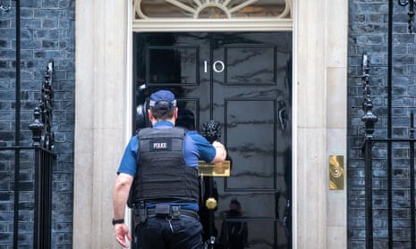 A police officer outside 10 Downing Street, London.