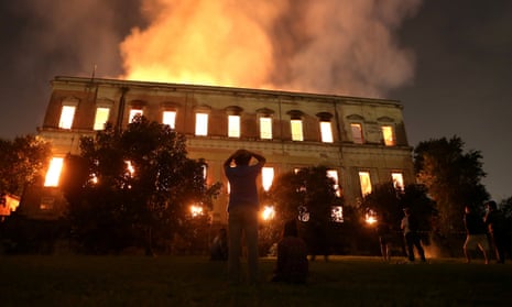 People watch as a fire burns at the National Museum of Brazil in Rio de Janeiro on 2 September 2018.