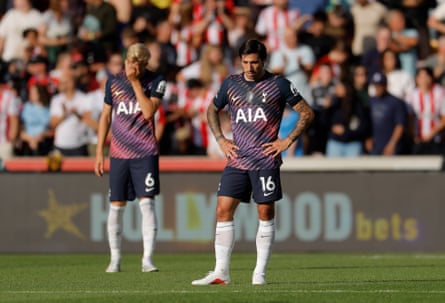 Jan Paul van Hecke (left) covers his face and Sandro Tonali (right) looks down at the pitch with his hands on his hips