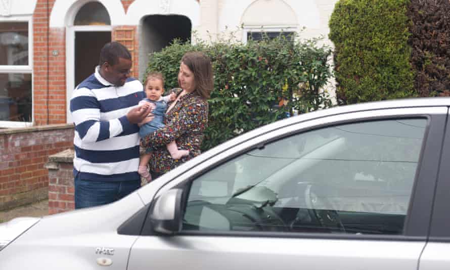 Jonathan & Jess Daly with baby Robyn at home in Norwich, UK. Image shows the family car with Jess, the main driver.