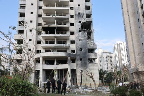 Israeli emergency service teams operate at the scene where Iranian ballistic missiles hit residential buildings in Petah Tikva, central Israel, 16 June 2025.