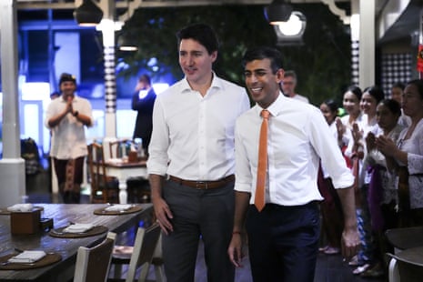 Justin Trudeau, left, and Rishi Sunak walk at the Art Cafe Bumbu Bali in Bali.