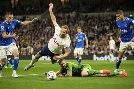 Everton’s Jordan Pickford fouls Tottenham Hotspur’s Harry Kane to concede a penalty.