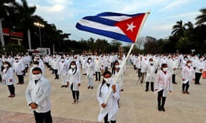 A group of doctors participate in an event before leaving to South Africa at Jose Marti International Airport in Havana, Cuba, 25 April 2020.