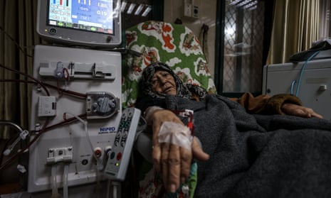 A Palestinian women receives dialysis treatment at the Al-Aqsa Martyrs Hospital on February 8, 2024.