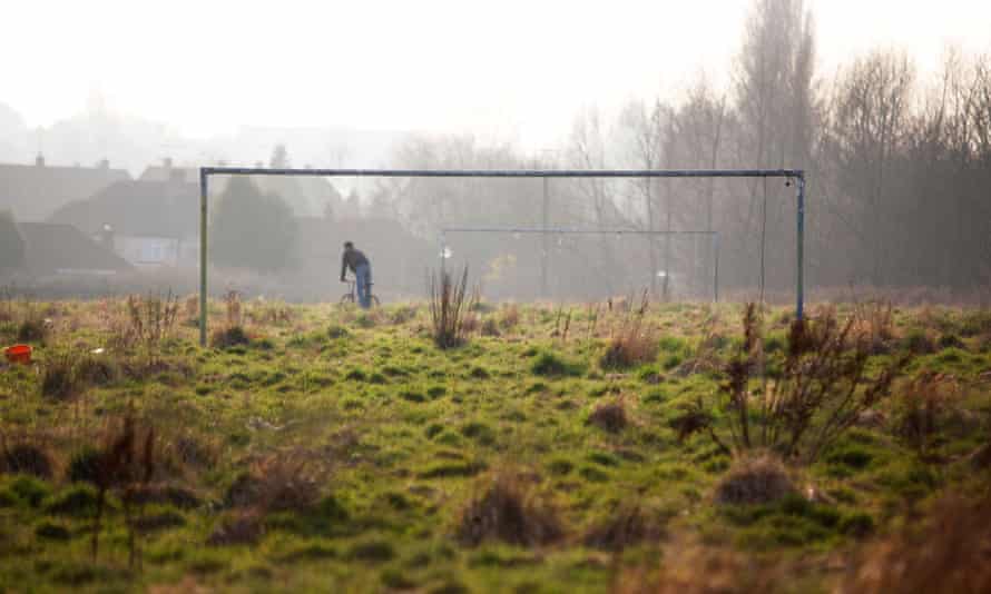 An overgrown and abandoned football pitch