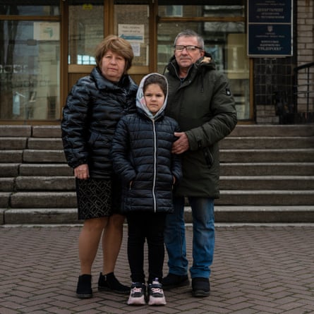 Iryna and Serhiy with their granddaughter Valeriya, photographed in April 2022 in Zaporizhzhia, a month after the theatre strike in Mariupol.