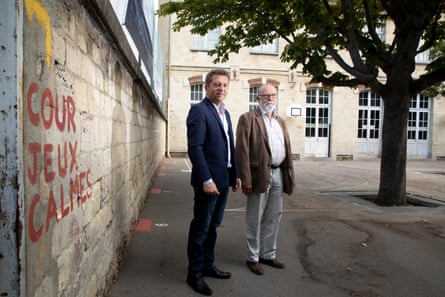 Sébastien Maire, the chief resilience officer of Paris (left), and Stephan Lajous, head of the 20th arrondissement architecture section, in the schoolyard of École Riblette.
