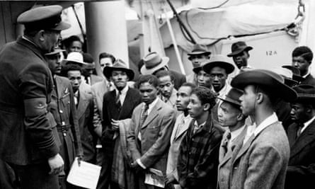 Jamaican immigrants welcomed by RAF officials after disembarking from the Empire Windrush at Tilbury.