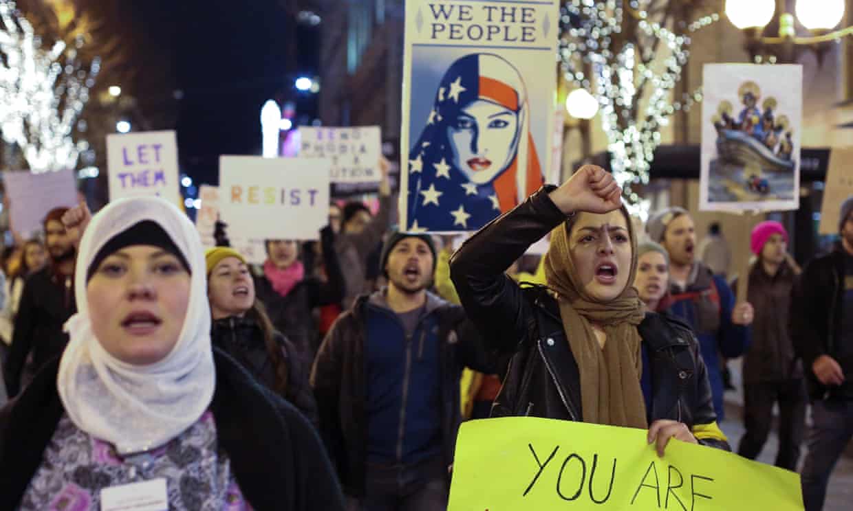 People march through downtown Seattle during a protest held in response to Donald Trump’s travel ban.