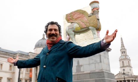 Michael Rakowitz in front of his sculpture