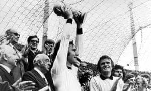 Franz Beckenbauer lifts the World Cup trophy for West Germany after beating the Netherlands in the 1974 final.