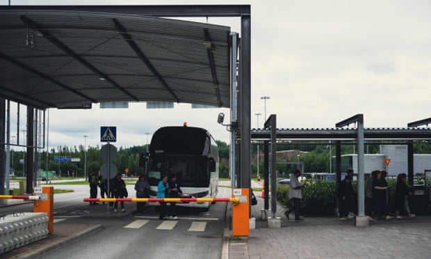 Russian tourists arriving by bus at the Nuijamaa border crossing in Finland