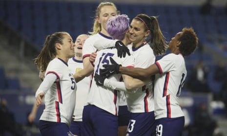 Megan Rapinoe is congratulated by teammates after scoring her penalty