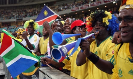 South African fans blow vuvuzelas at a friendly football match ahead of the 2010 FIFA World Cup.
