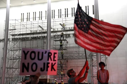 People wait on Friday for Donald Trump's name to be removed from the performing arts centre in Washington.