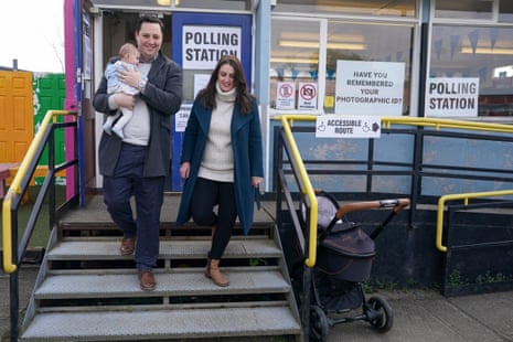 Ben Houchen, the Conservative Tees Valley mayor, his wife, Rachel, and their baby daughter Hannah leaving a polling station after voting in Yarm, England.