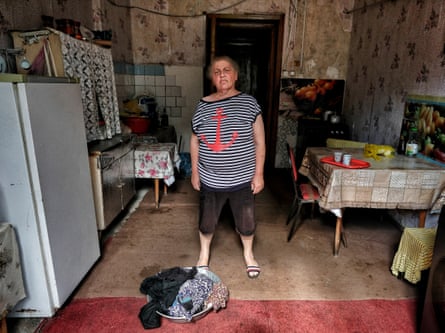A woman in an old kitchen