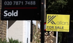Signs mark homes being sold or available for sale in London