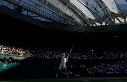 Jannik Sinner of Italy stretches to return a serve from Alexander Zverev.