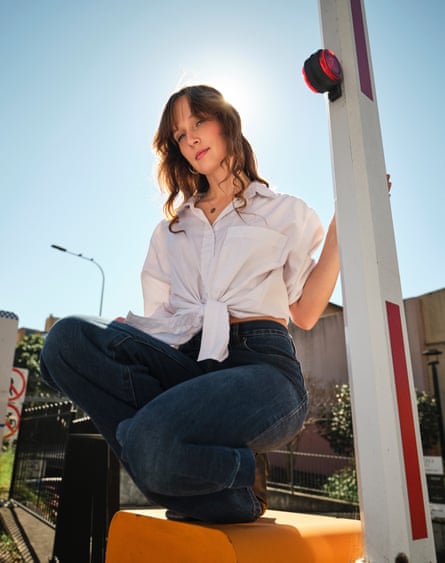 Gretta Ray crouching on a yellow box