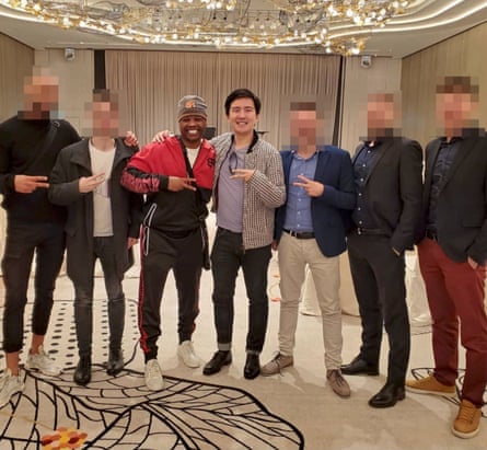 Rodney Burton and Sam Lee standing with five other unidentified men in what was claimed to be the Dubai corporate office of HyperFund