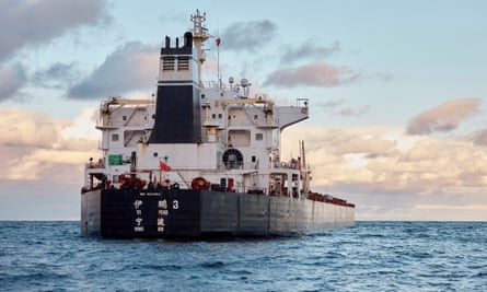 rear view of the Chinese ship showing its control tower and black hull