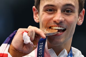 Tom Daley of Great Britain savours his bronze medal.
