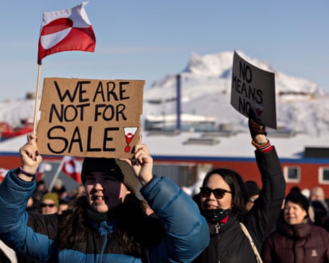 People protest under the slogan, "Greenland belongs to the Greenlandic people", in Nuuk, Greenland.