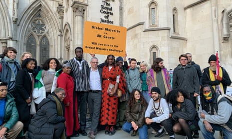 Climate activists outside the Royal Courts of Justice in London. 