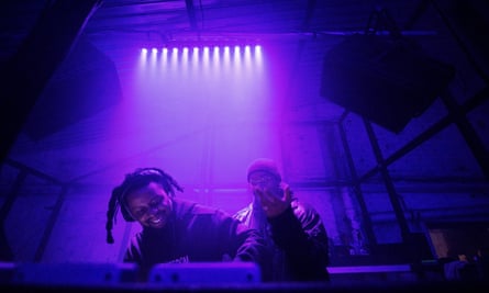 DJs and purple lighting 