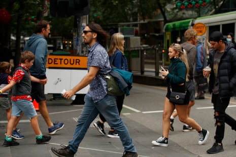 People are seen without face masks on November 23, 2020 in Melbourne, Australia. Covid-19 restrictions have relaxed further in Victoria as the state continues to record no new coronavirus cases.
