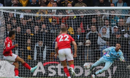 Wolves goalkeeper José Sá saves a penalty from Nottingham Forest’s Brennan Johnson