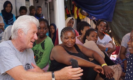 Richard Gere is seen with people onboard the Open Arms vessel