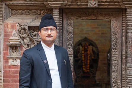 Sanjay Adhikari in front of the Laxmi Narayan Temple in Lalitpur district, whose main statue of he helped to recover from the US.