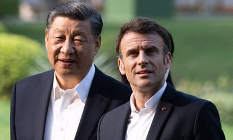 Emmanuel Macron (left) and Xi Jinping visit the garden of the residence of the governor of Guangdong in China on Friday