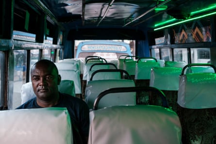 Duncan Wade inside a parked matatu in Kibera.