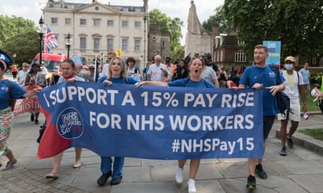 NHS staff, members of the trade unions and health campaigners takes part in a protest march through central London demanding 15% pay increase for health workers.